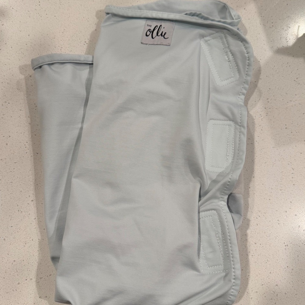 The Ollie Swaddle Adjustable Baby‎ Wrap Light Blue Moisture Wicking Jersey